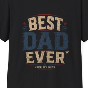May include: Black t-shirt with the text "BEST DAD EVER" in a distressed font. The text is in red, blue, and tan colors. Below the text is "*PER MY KIDS". The shirt has short sleeves and a crew neck.