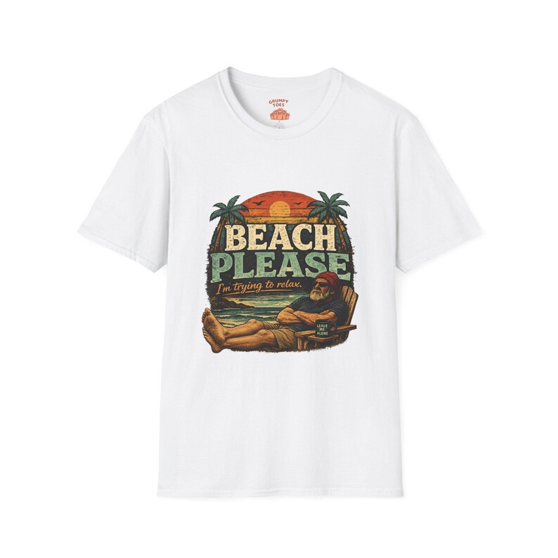 A white t-shirt with a graphic design featuring a man relaxing on a beach chair with palm trees and a sunset in the background.