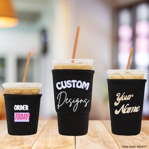 May include: Three black neoprene cup sleeves for iced beverages, each with a clear plastic lid and orange straw. The left sleeve features the text ORDER TODAY in white and pink. The center sleeve says CUSTOM Designs in white. The right sleeve says Your Name in gold.