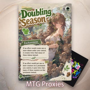 May include: A Doubling Season Magic the Gathering proxy card featuring an illustration of a person with long brown hair surrounded by squirrels in a forest setting. The card text describes enchantment rules and includes a green squirrel icon and acorn.