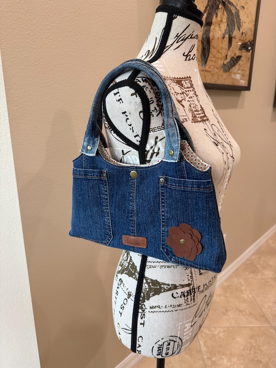 Up-Cycled top handle denim purse.