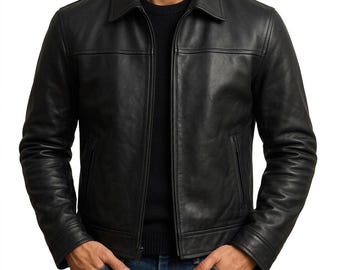 May include: A black leather jacket with a collared neckline and a front zipper closure. The jacket has two side pockets and a tailored fit. The model is wearing a black sweater and blue jeans.