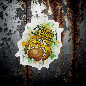 May include: A white sticker with a cartoon image of a loaded baked potato. The sticker has the text "I identify as a potato. I like getting baked, smashed, stuffed and eaten."