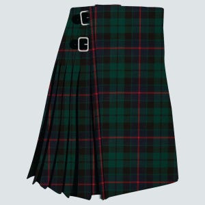 May include: A green, black, and red plaid kilt with two silver buckles. The kilt features a pleated design and a traditional tartan pattern. The kilt is made of a woven fabric and is designed to be worn around the waist.