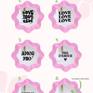 May include: Pink wavy-edged mirrors with various text options in black, including "LOVE YOUR SELF", "LOVE LOVE LOVE", "AMOR MIO", "FOUS D'AMOUR", and "amour". The image also includes instructions in French.
