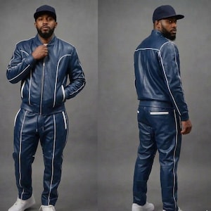 May include: A navy blue leather tracksuit with white piping. The jacket has a zip-up front and pockets. The pants have a drawstring waist and pockets. The person is wearing a navy blue baseball cap and white sneakers.