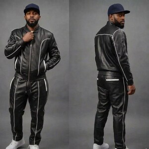May include: A black leather tracksuit with white trim and a matching black baseball cap. The jacket is zipped and the trousers have a drawstring. The outfit is worn with white trainers.