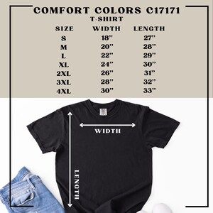 May include: Black Comfort Colors T-shirt with size chart. The chart displays measurements for width and length in inches for sizes S to 4XL. The text "COMFORT COLORS C17171 T-SHIRT" is at the top.