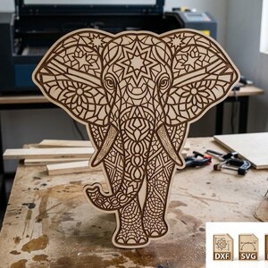 May include: A wooden elephant cutout with intricate geometric patterns. The elephant is brown and stands on a wooden surface. The image includes a laser cutter and various tools, suggesting a craft or DIY project. The elephant is approximately 46 cm tall.
