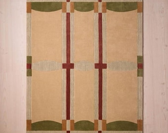 May include: Rectangular area rug with a beige central field, framed by a green border. Vertical burgundy stripes intersect with horizontal elements, creating a grid-like pattern. The rug's design incorporates curved green and beige accents.