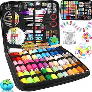 May include: A black zippered sewing kit filled with various sewing supplies. The kit includes spools of colorful thread, needles, scissors, measuring tape, pins, buttons, and other accessories. A smaller kit with more supplies is also visible.