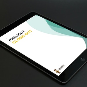 May include: A black tablet displaying a white document with the words "PROJECT CLOSE-OUT" in black and yellow text. The document has a teal and white design in the upper right corner. The tablet is on a black surface.