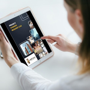 May include: A person using a tablet displaying a "Project Change Request Log" interface. The tablet screen shows a dark background with text and several image thumbnails. A stylus is used to interact with the screen.