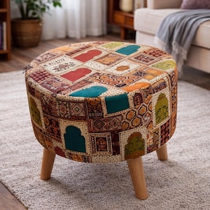 May include: A round ottoman with a patchwork design in shades of red, teal, orange, and gold. The upholstered top sits on three wooden legs. This decorative footstool adds a touch of color to any living space.