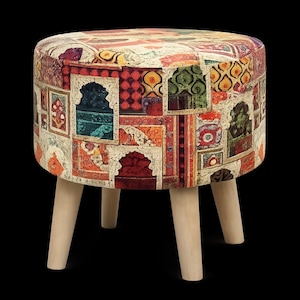 May include: A round ottoman with a patchwork design featuring various colors and patterns. The fabric-covered top rests on four light-colored wooden legs. The ottoman's design includes red, orange, green, and blue hues.