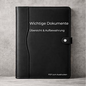 May include: A black leather document holder with a snap closure. The cover features the text "Wichtige Dokumente Übersicht & Aufbewahrung" and "PDF zum Ausdrucken" in white. The holder has a vertical pocket on the left side.