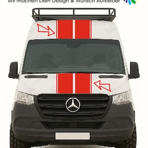 May include: White van featuring red racing stripes and a roof rack. The vehicle has black detailing, a Mercedes-Benz emblem, and large off-road tyres. The text "Seitenstreifen.com" is displayed at the top.