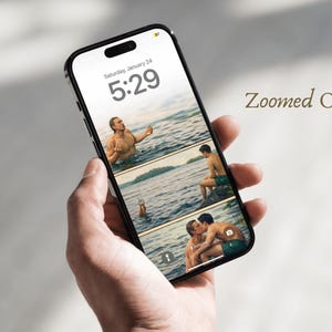 May include: A smartphone screen shows a series of images of two people in a body of water. The phone screen displays the date and time as Saturday, January 24, 5:29. The words "Zoomed Out" are written on the right side of the phone.