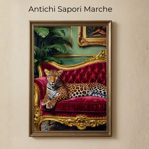 May include: A framed print depicting a leopard reclining on a red velvet sofa with gold detailing. The artwork has a vintage style, with the text "Antichi Sapori Marche" at the top. The background includes a green wall and a painting.