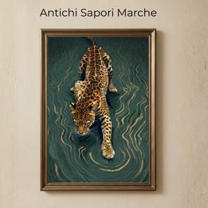 May include: A framed art print featuring a leopard with a spotted coat, depicted in a stalking pose. The artwork has a dark teal background with gold-colored swirling patterns. The text "Antichi Sapori Marche" is at the top.