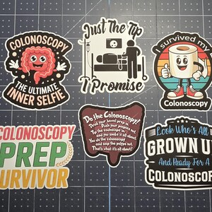 May include: A collection of six vinyl stickers featuring medical themes related to colonoscopies. The designs include a cartoon intestine, a medical procedure scene, a toilet paper roll character, and various text slogans about colonoscopy prep.