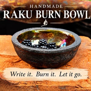 May include: A handmade Raku burn bowl with a rough, dark exterior and a metallic, iridescent interior finish. The bowl contains several fresh blackberries. Text on the image reads: HANDMADE RAKU BURN BOWL and Write it. Burn it. Let it go.