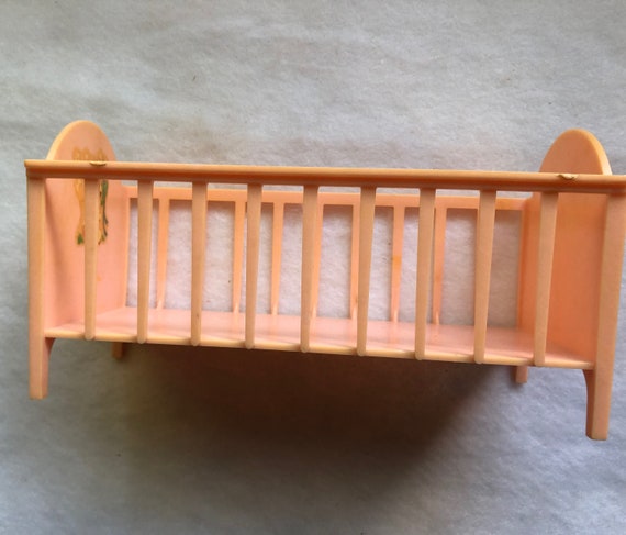 plastic doll cradle