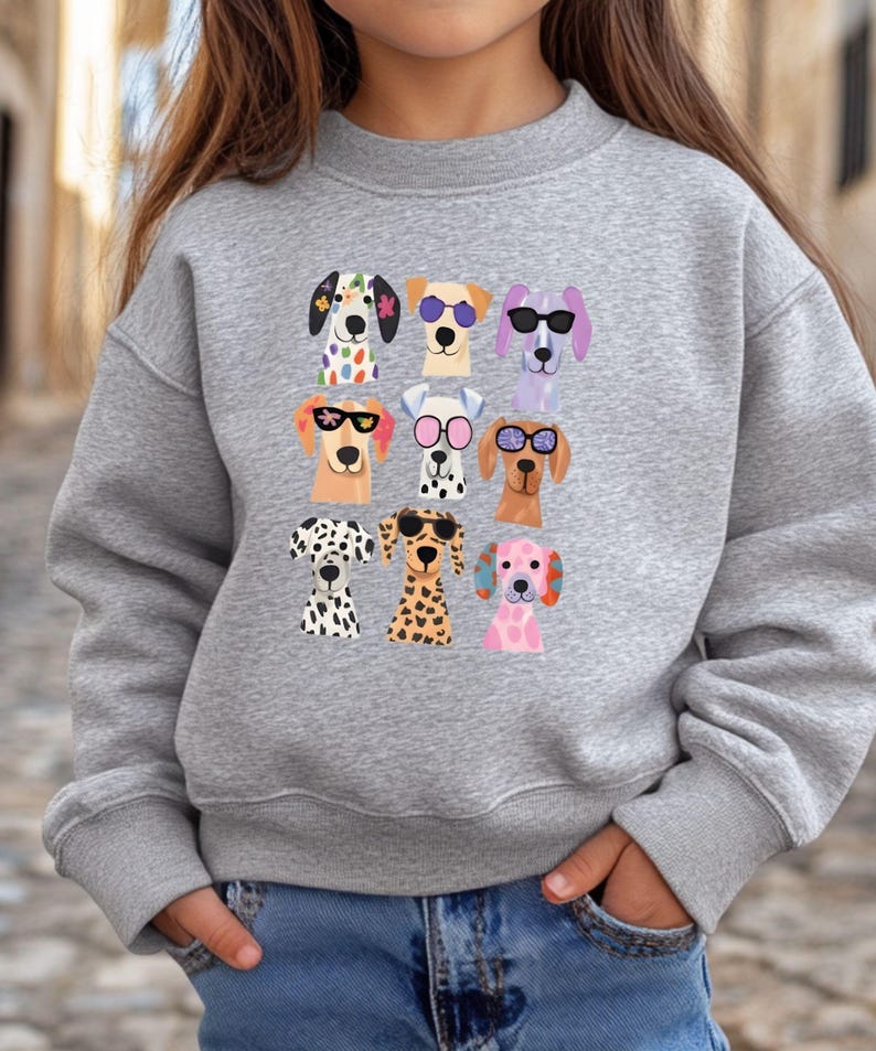 A gray sweatshirt with a graphic of nine cartoon dog faces wearing sunglasses.
