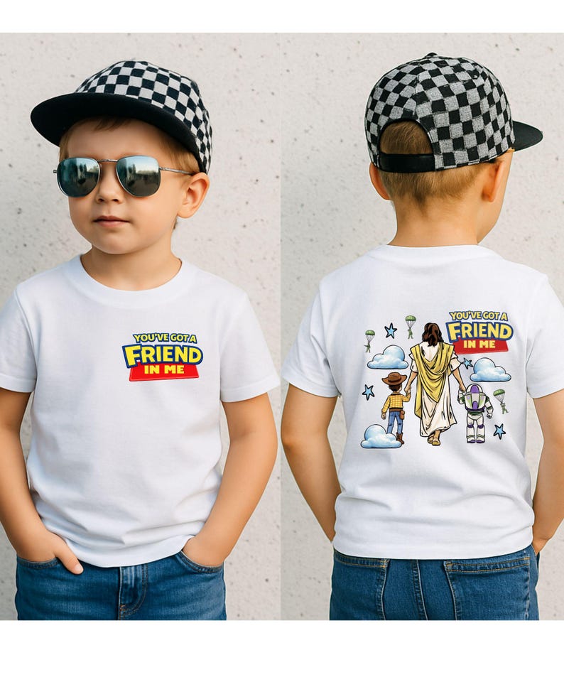 A young boy wearing a white t-shirt with a graphic design and a black and white checkered cap, along with sunglasses.
