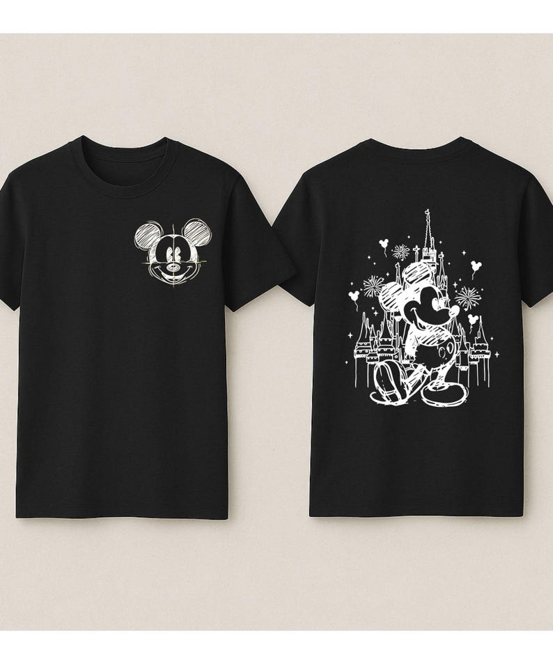 two black t-shirts with white designs on the back. The designs include Mickey Mouse and a castle.