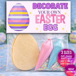 May include: An Easter egg decorating kit in a clear bag. The kit includes two egg-shaped cookies, pink and blue icing bags, and colorful sprinkles. The kit is labeled "DECORATE YOUR OWN EASTER EGG" and offers three sizes: 4x4", 5x5", and 6x5".