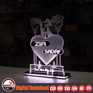 May include: A lighted heart-shaped decorative piece with the names "ZIA" and "SADAF" displayed. The design includes a couple, roses, and the text "You Are My Life". The base has a digital download logo.