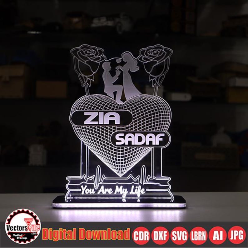 May include: A lighted heart-shaped decorative piece with the names "ZIA" and "SADAF". The design includes a couple, roses, and the text "You Are My Life". The base has a rectangular shape. The image also includes the text "Digital Download CDR DXF SVG LBRN AI JPG".
