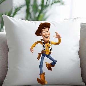 May include: White square pillow featuring a colorful image of the character Woody from the animated film Toy Story. Woody is depicted in his cowboy attire, including a brown hat, yellow shirt, blue jeans, and brown boots.