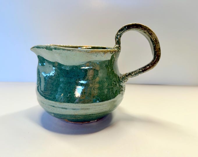 Featured listing image: green pitcher with carved handle