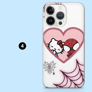 May include: A white phone case with a pink heart design featuring Hello Kitty and Spider-Man. The case has a spider web design and a small spider. The number 4 is in a black circle in the upper left corner.