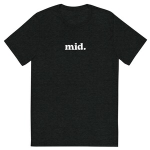May include: Dark gray t-shirt with the word "mid." printed in white, centered on the chest. The shirt has a crew neck and short sleeves. The fabric appears to be a soft, heathered material.