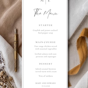 May include: A minimalist wedding menu card with the text "The Menu" in elegant script. The menu lists starter, main course, and dessert options. A gold fountain pen and dried flowers are on the left. The date is 17.12.202X.
