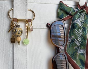 The “golden thread” Bag Charm