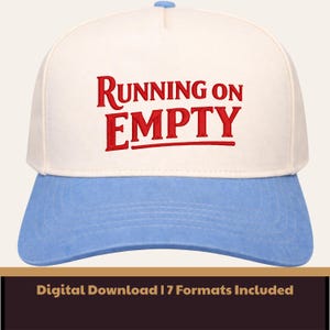 May include: A baseball cap with a white crown and a light blue brim. The text "RUNNING ON EMPTY" is embroidered in red across the front. The cap has a curved brim and a button on top.
