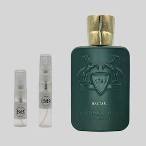 May include: A green perfume bottle with a gold cap and two smaller spray bottles. The perfume bottle has a shield design with two horses and the text "HALTANE" and "PARFUMS de MARLY PARIS". The smaller bottles have "BiB" labels.