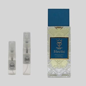 May include: A perfume bottle with a blue cap and a diamond-patterned glass body, labeled "Hectic." Two small spray bottles with "BiB" labels are to the left. The perfume bottle is 3.4 fl oz.
