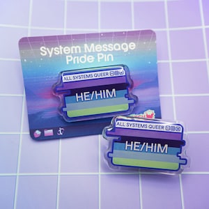 May include: Two clear acrylic pins with a system message design. The pins are purple, blue, and green with the text "ALL SYSTEMS QUEER" and "HE/HIM".