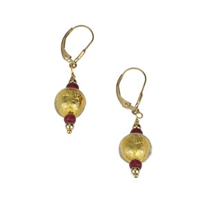 May include: Gold and burgundy glass bead earrings with gold leaf accents and leverback closures.