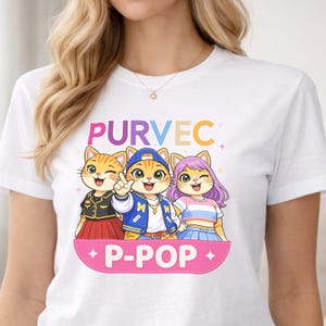 May include: White t-shirt featuring the word "PURVEC" above three cartoon cat characters. The cats are wearing different outfits and the text "P-POP" is displayed on a pink banner below them. The design is colorful and playful.