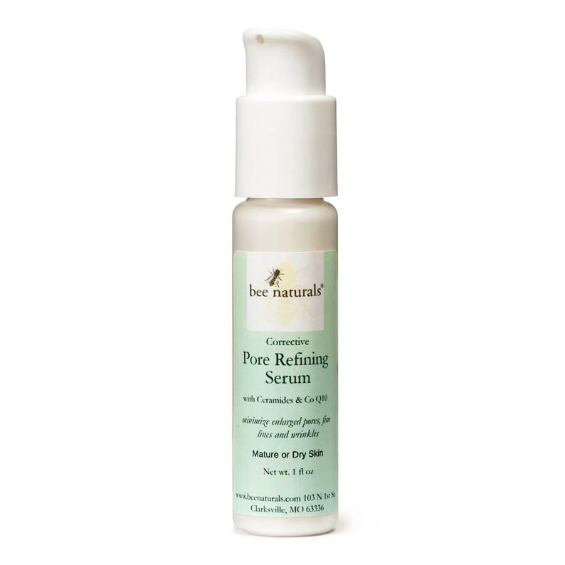 May include: A white bottle of Bee Naturals Corrective Pore Refining Serum with Ceramides & Co Q10. The bottle is labeled for mature or dry skin and has a net weight of 1 fl oz.