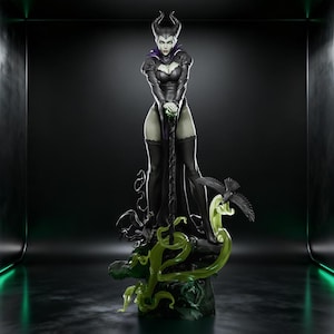 May include: A detailed figurine of a character in a black dress with a high collar, horns, and a staff. The figure stands on a base with green, flowing accents and a black raven. The overall design has a fantasy theme.