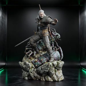 May include: A detailed figurine of a white-haired warrior in dark leather and chainmail armor, standing in a combat stance on a rocky base. The figure holds a long sword and is positioned over a dark, multi-legged creature with a textured shell.
