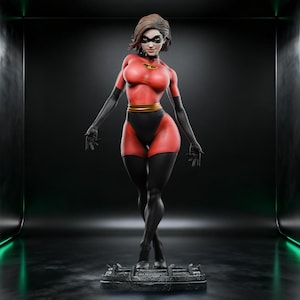 May include: A red and black superheroine statue with a gold belt and black gloves. The figure has a mask and short brown hair. The statue is standing on a textured base in a dark studio setting.