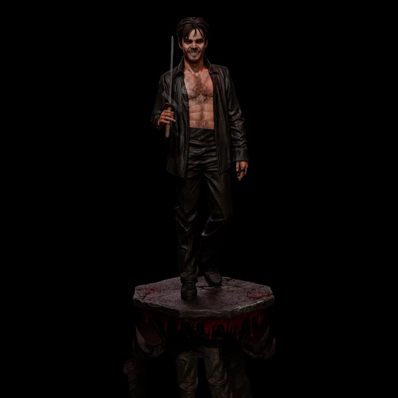 May include: A figurine of a man in a black leather shirt and pants, holding a sword. The figure is standing on a stone platform with red accents, against a black background. The man is smiling.